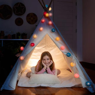 attractive-cute-girl-sitting-inside-tepee-tent-her-bedroom-enjoy-happy-time_554837-237