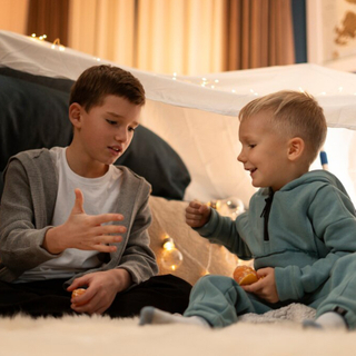 full-shot-kids-playing-together-night_23-2149212290